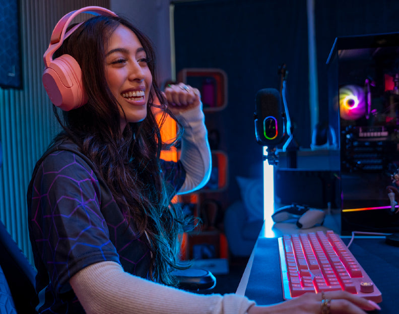 Gamer using the JLab Nightfall gaming headset